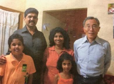 <p>Pastor Anura (left) and his family with Pastor Fuji (right). Photo supplied.</p>
