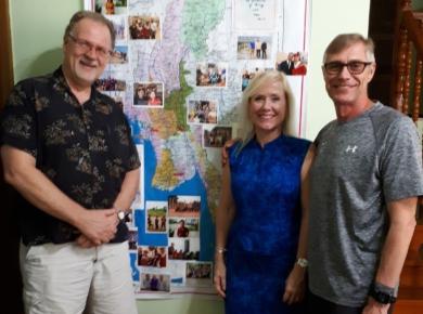 <p>MB Mission/Multiply workers Louise and Dave Sinclair-Peters with Victor Wiens in front of a map of Myanmar. Photo: Victor Wiens</p>