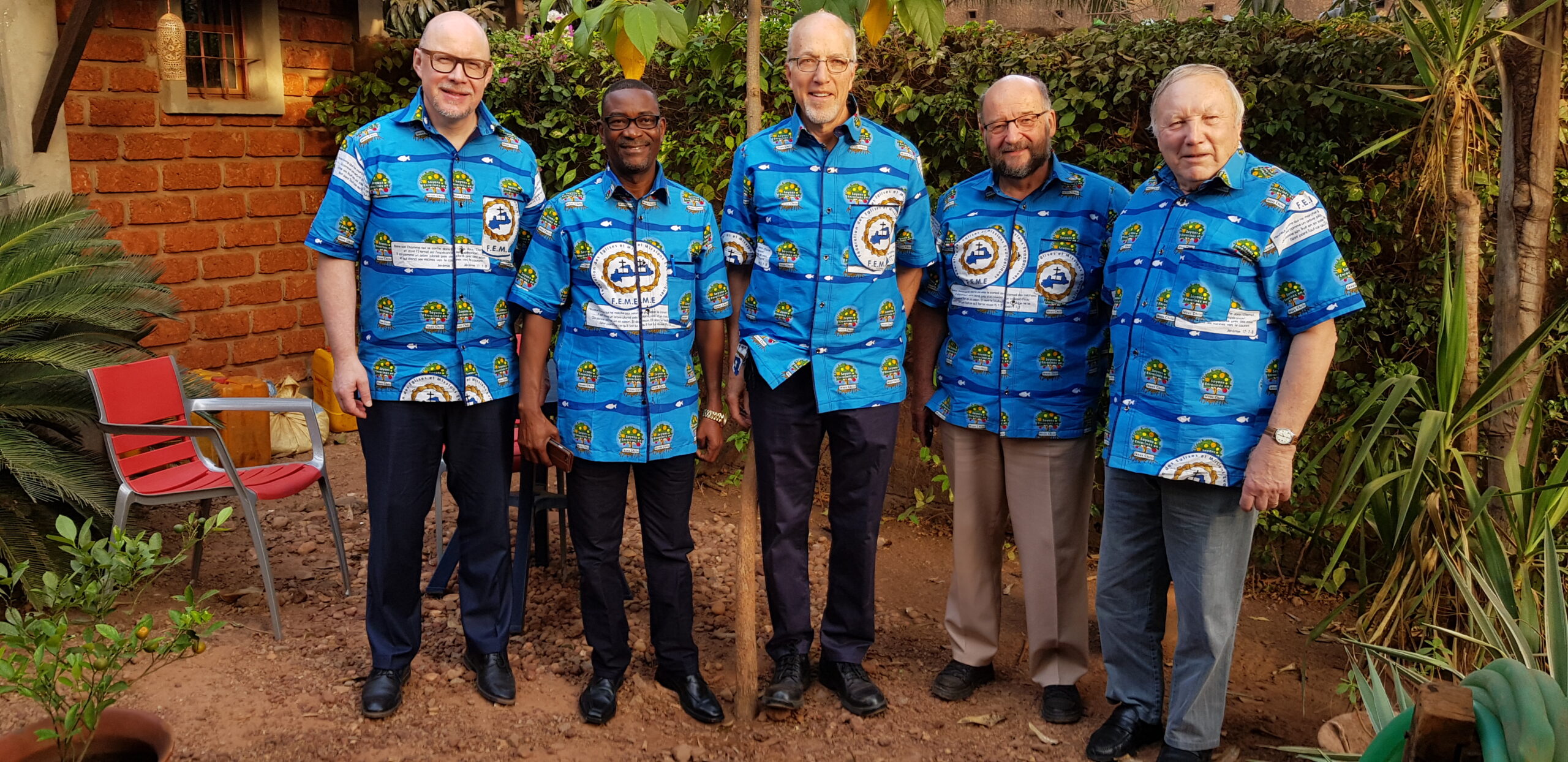 men in matching African cloth shirts