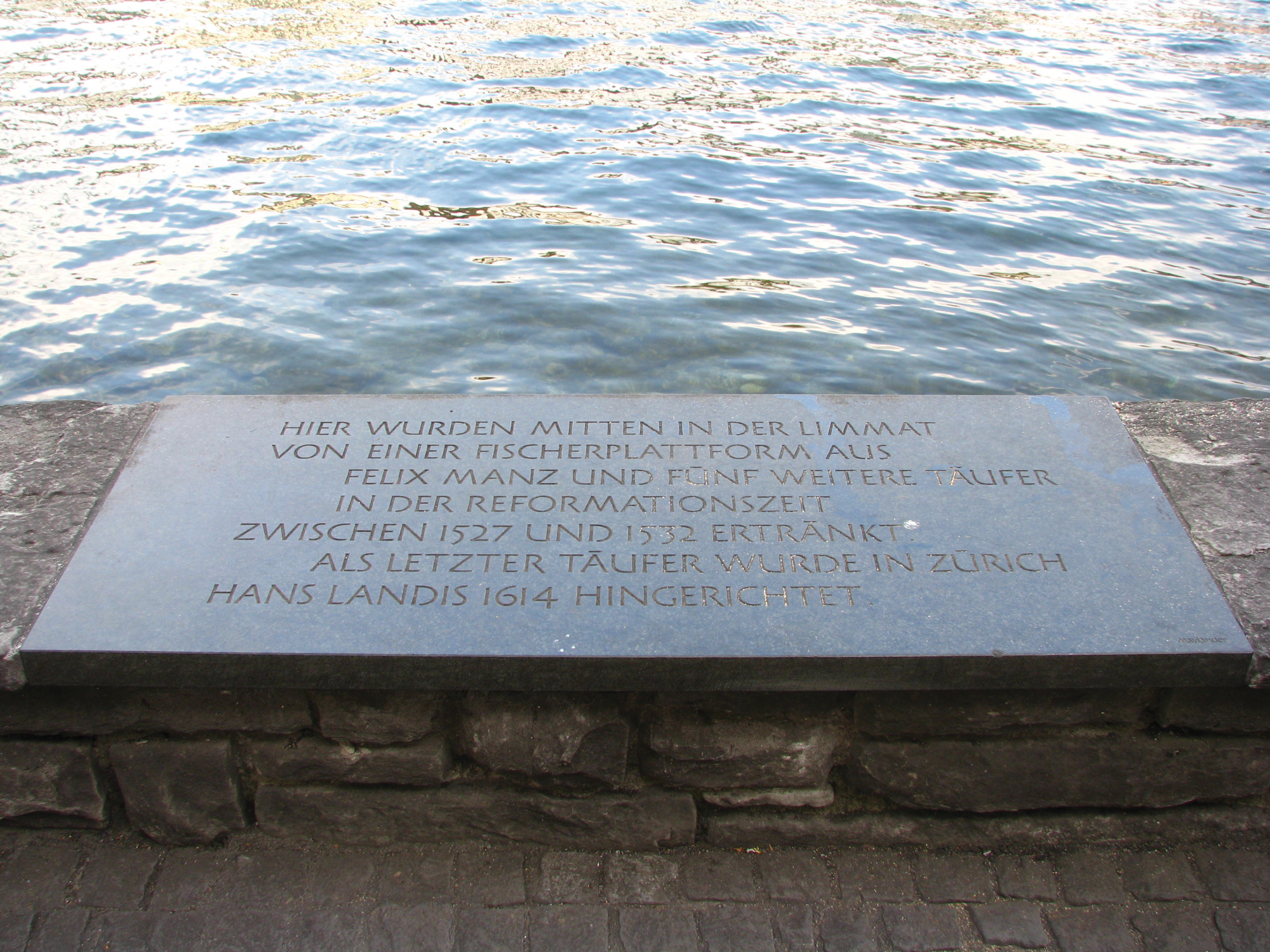 A memorial stone to Anabaptist martyrs drowned in the Limmat River in Switzerland. Photo: Roland zh, Wikimedia Commons