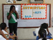 Damaris Guaza Sandova of Colombia facilitates a workshop on self esteem for a fourth-grade class at the Francisco Morazán school in La Ceiba, Honduras. 