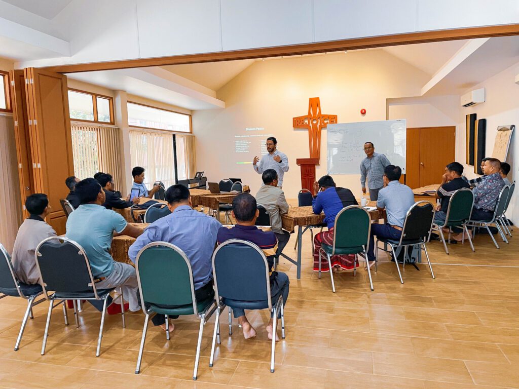 Andres Pacheco Lozano shares stories of Colombian peace struggles with the leaders from Myanmar during the Deacon delegation visit.