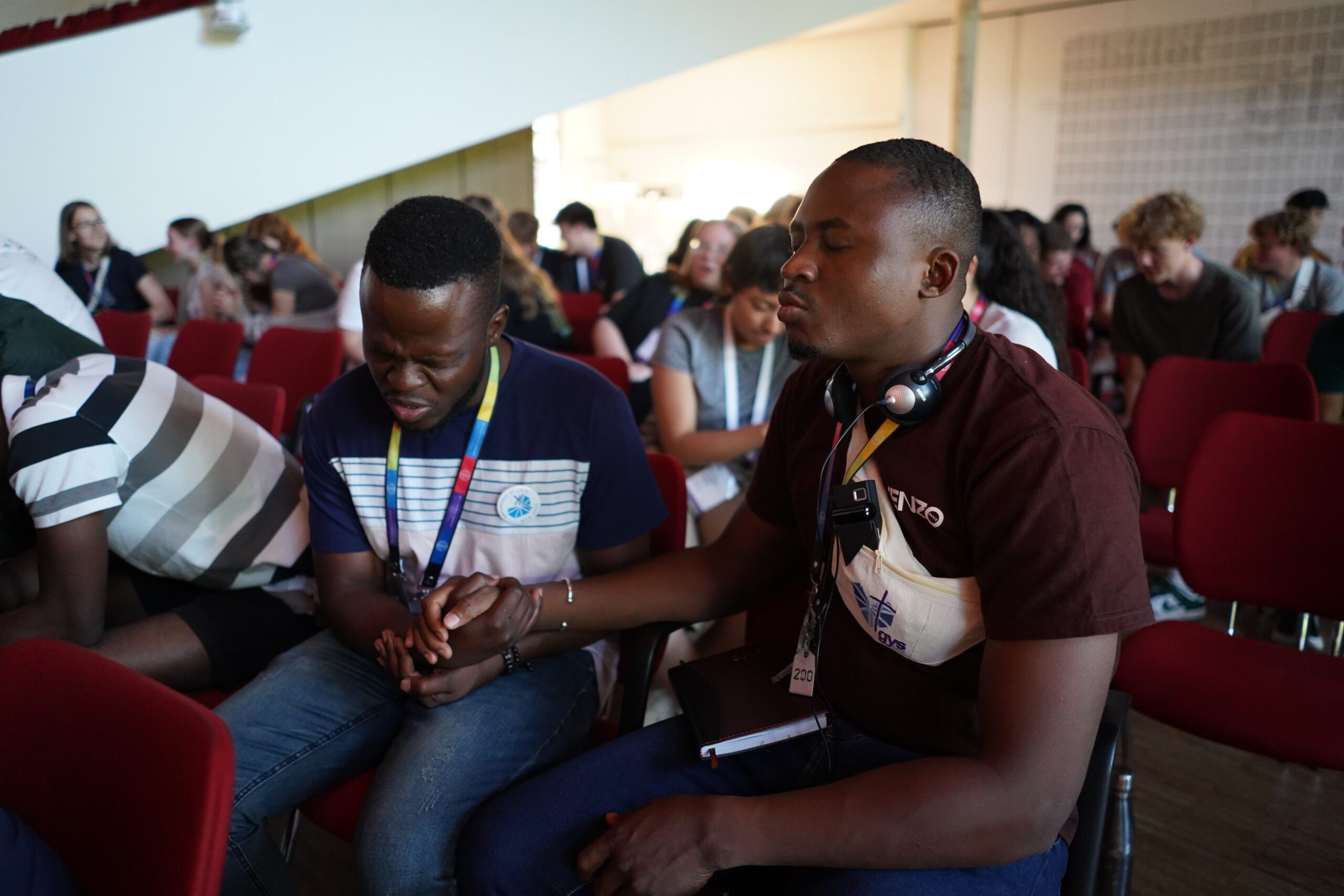 YABs delegates praying for each other