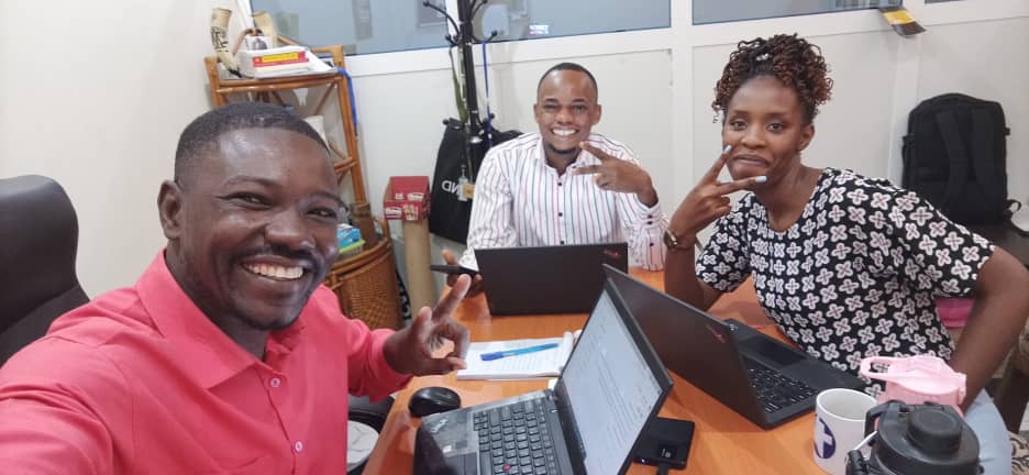 Moses Jumbo with MCC program coordinator Jonathan Nguerassem and fellow YAMENer Beatrice Uwase from Rwanda at work at the MCC office in Chad where he served as the partnership and reporting assistant.