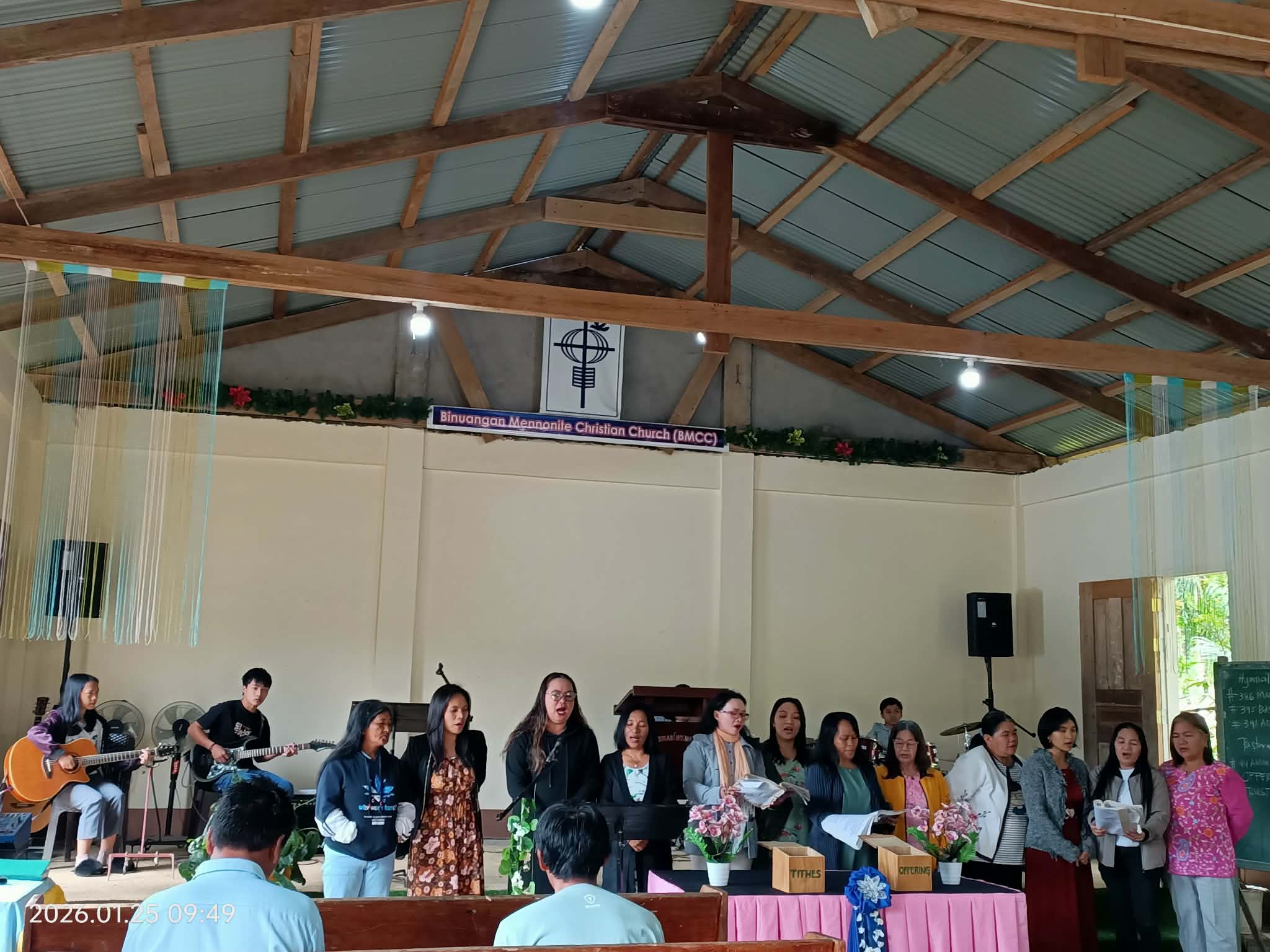 group of  Filipino singing at a church