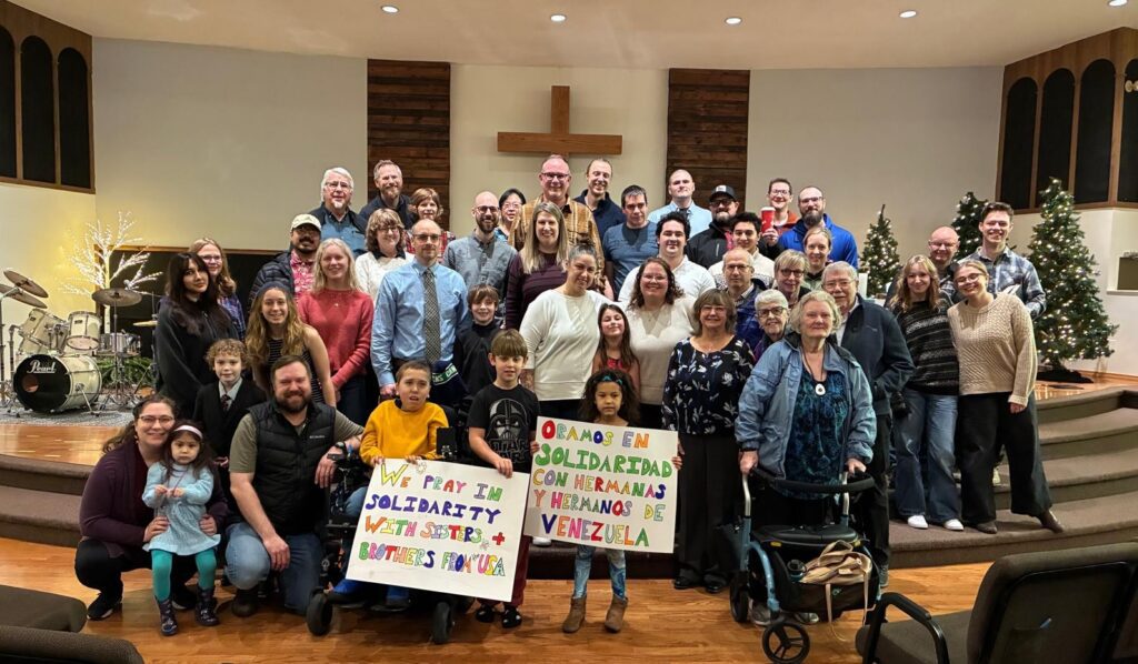 group of standing people holding banners