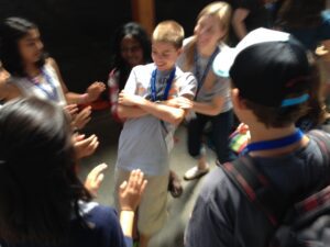 Andrew Kipfer, USA, does a trust fall with a group of youth at PA 2015. PHOTO CREDIT: Laura Kraybill