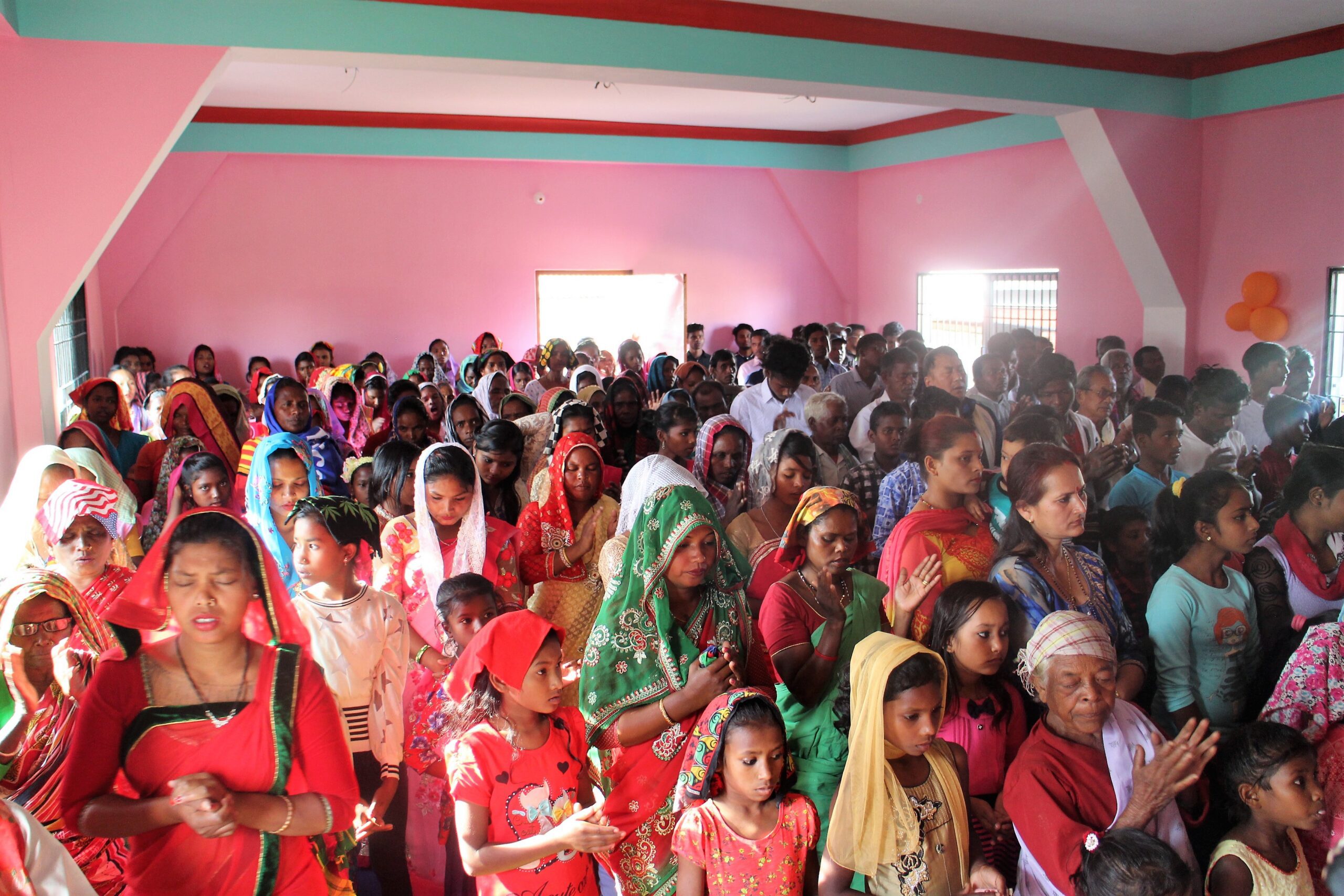 group of women praying in Nepal