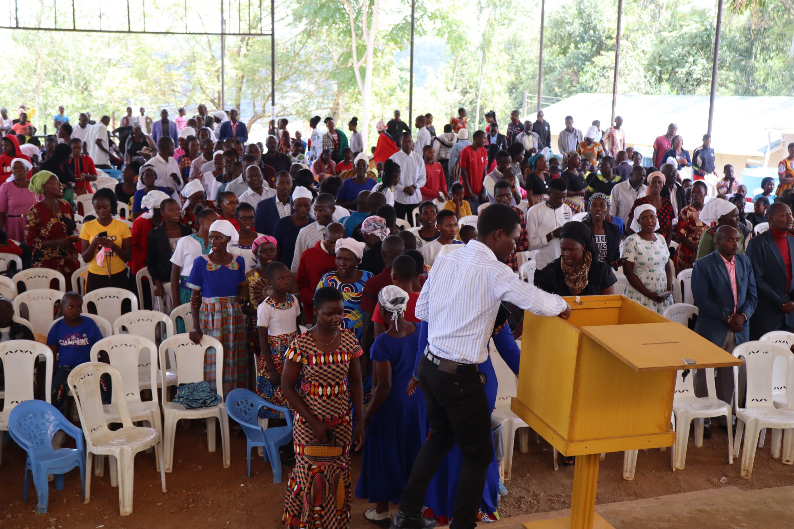 church members giving offering during service
