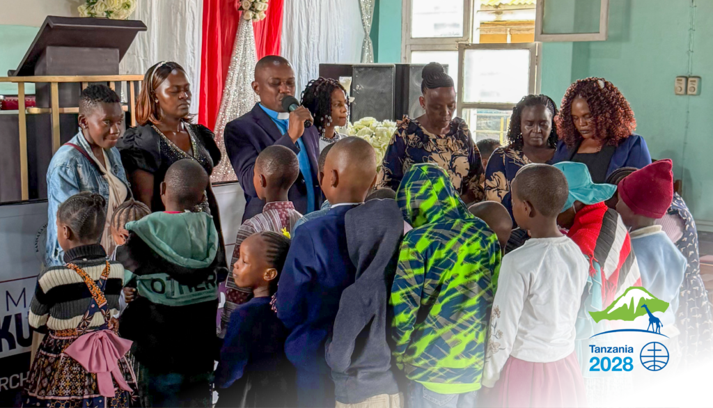 Group prayer for the children at church